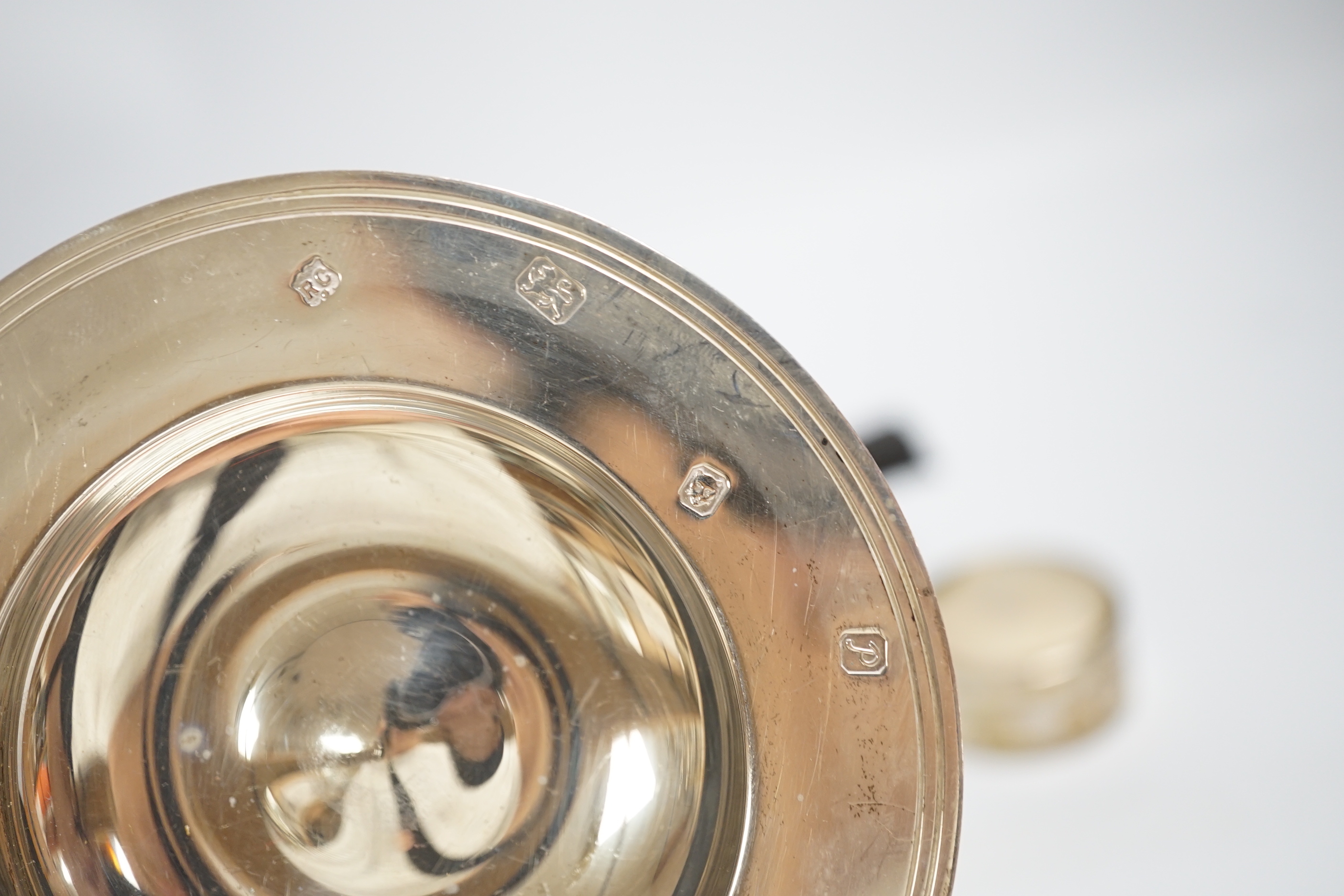 Two small modern silver dishes, a silver tea strainer and two Scandinavian items.